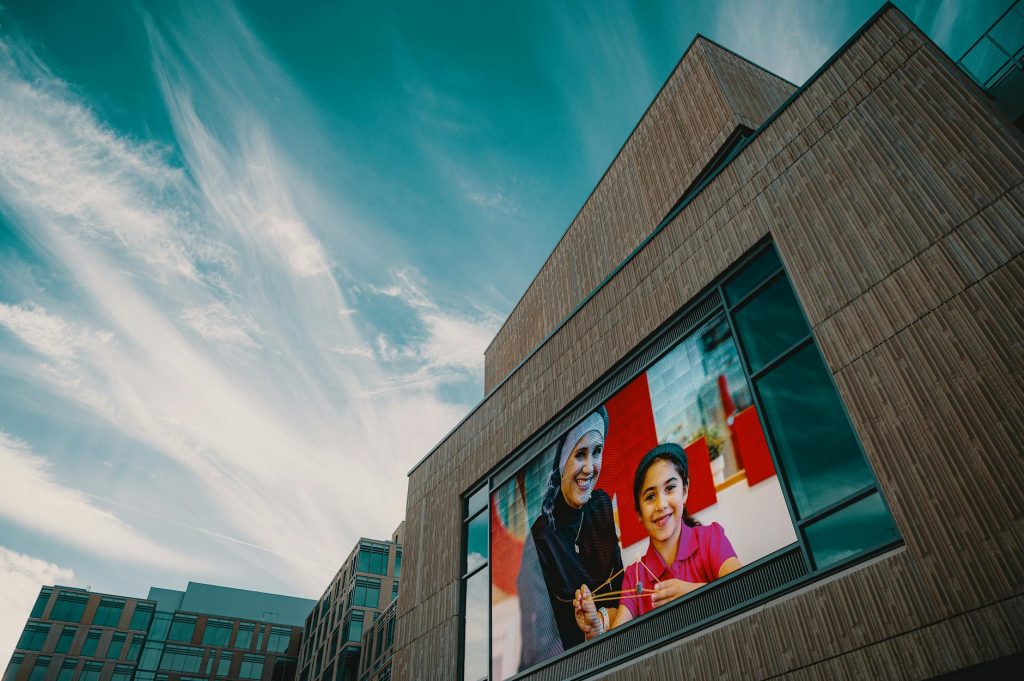 a giant screen on a building wall